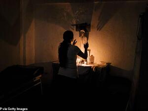 The spiritual leader spends time consulting with patients before performing rituals, as above, and prescribing them potions based on plants and fruits. (AFP/ File Photo)