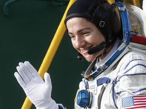 NASA's US astronaut Jessica Meir waves as she boards the Soyuz MS-15 spacecraft before its blasts off for the ISS, on September 25, 2019. (AFP/ File Photo)