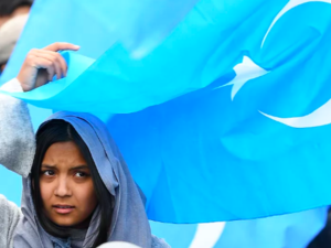 A woman takes part in a rally urging the European Union to pressure China to close its reeducation camps in Xinjiang, where nearly 1 million Uighur Muslims are detained. The rally was held in Brussels on April 27, 2018. Emmanuel Dunande/AFP via Getty Images