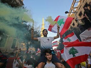 Lebanese protesters demand better living conditions and the removal of a cast of politicians who have monopolised power and influence for decades at Riad al-Solh Square in Beirut. (AFP)