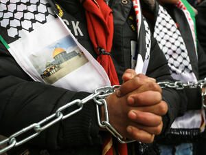 Palestinians protest against human rights center demanding action to save lives of Palestinian prisoners in Israeli jails. (Shutterstock/ File Photo)