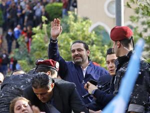 Lebanese prime minister Saad Hariri greets his supporters upon his arrival at his home in Beirut on November 22, 2017. (Marwan Tahtah / AFP)