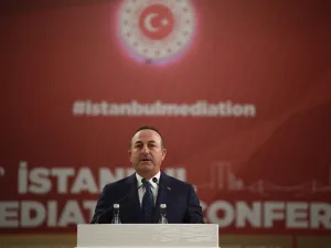 Turkish Foreign Minister Mevlut Cavusoglu speaks as the U.N. Secretary General listens on during the Third OIC Member States Conference on Mediation in Istanbul, on October 31, 2019. BULENT KILIC / AFP
