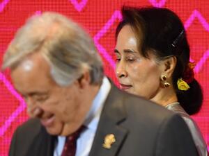 Myanmar's State Counsellor Aung San Suu Kyi (R) walks past UN Secretary-General Antonio Guterres during the 10th ASEAN-UN Summit in Bangkok on November 3, 2019, on the sidelines of the 35th Association of Southeast Asian Nations (ASEAN) Summit. Manan VATSYAYANA / AFP
