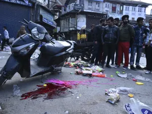 People gather at the site of a grenade blast at a market in Srinagar on November 4, 2019. At least one person was killed and 17 injured on November 4 in a grenade blast at a crowded market in Indian-administered Kashmir's main city of Srinagar, police and doctors said. Tauseef MUSTAFA / AFP