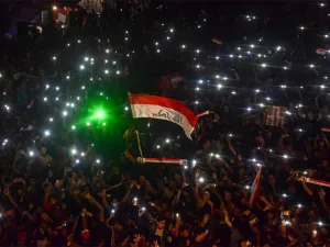 Iraqi protesters gather during a late anti-government demonstration in Nasiriyah, the capital of the southern province of Dhi Qar on November 4, 2019.  (AFP)