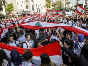Lebanese students wave national flags and chant slogans as they gather in an anti-government demonstration in the southern city of Sidon (Saida) on November 6, 2019. (AFP/ File Photo)