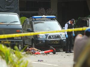 Indonesian police examine a body of a suspected suicide bomber at their headquarters in Medan, North Sumatra, on November 13, 2019, after a suicide attack occured during their morning roll call. (AFP/ File Photo)