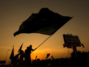 Iraqi protesters wave a flag during a demonstration during ongoing anti-government demonstrations in the southern city of Basra, on November 13, 2019. (AFP/ File Photo)