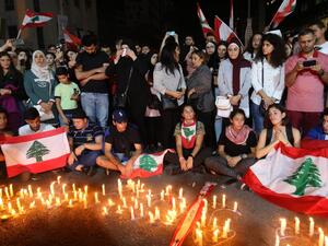 Lebanese demonstrators hold a candle light vigil in the the southern Lebanese city of Sidon (Saida) on November 13, 2019, for Alaa Abu Fakhr (photo), killed the day before during ongoing anti-government protests. Fakhr died of gunshot wounds overnight as the army opened fire to disperse protesters south of the capital, the second such death since the start of the largely peaceful protests. Mahmoud ZAYYAT / AFP