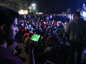 Protesters gather at a square in Iraq's central shrine city of Karbala to watch the the Group C FIFA World Cup 2022 qualifying football match between Iraq and Iran taking place in the Amman International Stadium in the Jordanian capital on November 14, 2019. Mohammed SAWAF / AFP