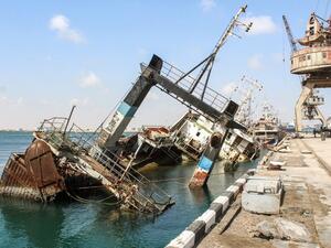 This picture taken on November 16, 2019 shows a view of a partially sunken ship by a pier at the fishing port of Yemen's second city of Aden in the Tawahi district overlooking the Gulf of Aden, which fell under the control of the Yemeni "Institution Protection Brigade". Saleh Al-OBEIDI / AFP
