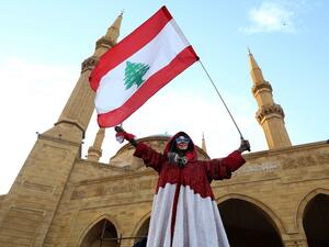 A Lebanese demonstrator is pictured in Beirut's Martyr Square during a gathering on Lebanon's Independence Day on November 22, 2019, and more than a month into protests demanding an overhaul of the entire political system. (AFP/ File Photo)