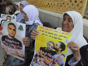 Relatives of Palestinian prisoner Sami Abu Diyak mourn at his house in Saylat al-Dahr town, south of Jenin city in the West Bank, on November 26, 2019, after news of his death of cancer in an Israeli jail. The death, which sparked Palestinian accusations of neglect, comes amid heightened tension with protests already scheduled in multiple places in the occupied West Bank today. Jaafar ASHTIYEH / AFP