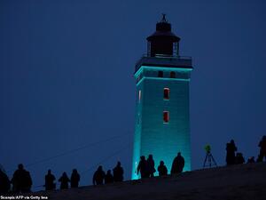 The Rubjerg Knude Lighthouse has now re-opened after the 120-year-old structure was moved 260ft away from the coastline. (AFP)