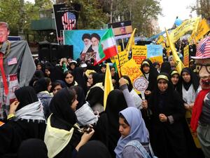 With anti-American slogans and effigies mocking U.S. President Donald Trump, thousands rally outside the former U.S. Embassy in Tehran on November 4. (AFP/ File Photo)