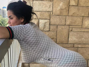 Guards asking Al-Masri to leave because she was not invited