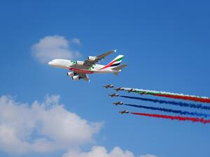 The Emirates A380 marks the opening of the Dubai Airshow with unprecedented flypast accompanied by 26 Military and Air Display Aircraft