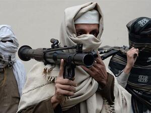 Former Afghan Taliban fighters hand over their weapons as part of a government reconciliation process in Nangarhar province. (AFP)