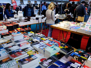 People choose books at the annual book fair. (Shutterstock/ File Photo)