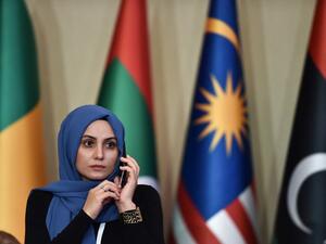A woman speaks on the phone the opening ceremony of the 35th Ministerial Session of the Standing Committee for Economic and Commercial Cooperation of the Organization of Islamic Cooperation (COMCEC) on November 27, 2019 in Istanbul. Ozan KOSE / AFP