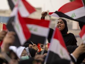 An Iraqi demonstrator chants as she takes part in an anti-government march in the center of the southern city of Basra on December 2, 2019. (AFP/ File Photo)