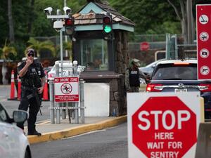 A guard stands by at the Nimitz Gate of Pearl Harbor in Hawaii shortly after a sailor fatally shot two civilians at the Pearl Harbor Naval Shipyard in Honolulu, Hawaii on December 4, 2019. (AFP/ File Photo)