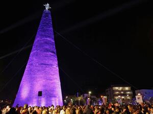 Lebanese visitors gather around a Christmas tree made of discarded plastic water bottles in the northern coastal town of Chekka, on December 15, 2019. (AFP/ File Photo)