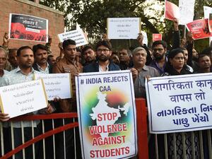 Protesters take part in a rally against India's new citizenship law outside the Gandhi Ashram in Ahmedabad on December 17, 2019. Fresh protests against India's new citizenship law erupted December 17 as alleged police brutality fuelled fury against the legislation which critics say is anti-Muslim. SAM PANTHAKY / AFP