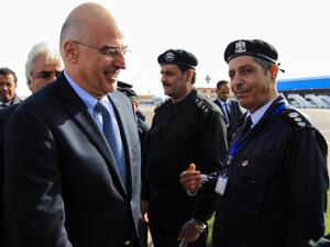 Libyan officials welcome Greek foreign Minister Nikos Dendias (L) upon his arrival to Benghazi airport on the eastern Libyan coast, on December 22, 2019. Greece's foreign minister visited Libya's Benghazi today, meeting representatives of strongman Khalifa Haftar's administration amid tensions with Turkey following Ankara's recent maritime agreement with Tripoli's unity government. Abdullah DOMA / AFP