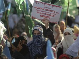 Women supporters of Pakistani political and Islamic party Jammat-e-Islami (JI), hold placards as they march during a protest in solidarity with Indian Kashmiri Muslims in Islamabad on December 22, 2019. Aamir QURESHI / AFP