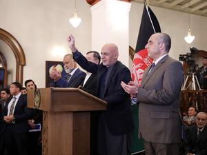 Afghan presidential candidate Ashraf Ghani (C) gives a speech during a press conference after the announcement of the preliminary elections results in Kabul on December 22, 2019. Afghanistan's President Ashraf Ghani appeared to have secured a second term on December 22, narrowly scoring an outright win in preliminary polling results, but his main rival immediately vowed to challenge the tally. STR / AFP