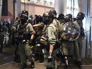 Riot police leave the Langham Place shopping mall after entering to search for protesters, in Mong Kok in Hong Kong on December 26, 2019. Hong Kong endured a third straight day of political unrest over the Christmas period on December 26 as police and pro-democracy protesters clashed inside shopping malls. Protesters spent the afternoon marching through multiple malls chanting anti-government and anti-police slogans. Philip FONG / AFP