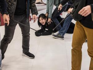 Plainclothes police officers detain a pro-democracy protester during a rally inside a shopping mall in Sheung Shui in Hong Kong on December 28, 2019. Hong Kong has been battered by more than six months of protests that has upended the financial hub's reputation for stability and helped tip the city into recession. DALE DE LA REY / AFP