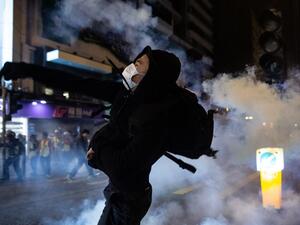 A protester reacts after police fire tear gas to disperse bystanders in a protest in Jordan district in Hong Kong, on early December 25, 2019. (AFP/ File Photo)