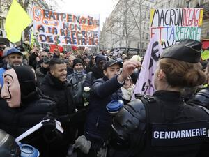 People hold banners reading " RATP on strike, no to pension reforms " during a protest called by French national trade union General Confederation of Labour (CGT), on January 4, 2020, in Paris. FRANCOIS GUILLOT / AFP