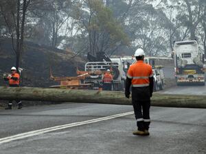 Firefighters were racing to contain massive bushfires across southeastern Australia Tuesday amid easing conditions as another heatwave loomed, as officials said the damage bill for the months-long crisis had risen to almost half a billion dollars.  SAEED KHAN / AFP