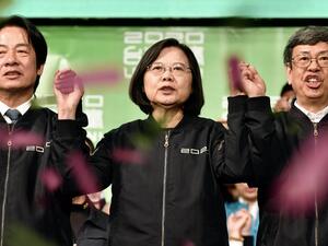 Taiwan President Tsai Ing-wen (C) joins her hands with Vice President-elect William Lai (L) and Vice President Chen Chien-jen outside the campaign headquarters in Taipei on January 11, 2020. President Tsai Ing-wen declared victory in Taiwan's election on January 11 as votes were being counted after an election battle dominated by the democratic island's fraught relationship with China.  Sam Yeh / AFP