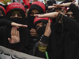 Shiite Muslims take part in a anti-US protest against the killing of top Iranian commander Qasem Soleimani in Iraq, in Lahore on January 12, 2020. Iran's Revolutionary Guards chief briefed parliament on January 12 over the killing of a top general by the US, Tehran's retaliation and the subsequent downing of an airliner, ISNA news agency said. ARIF ALI / AFP