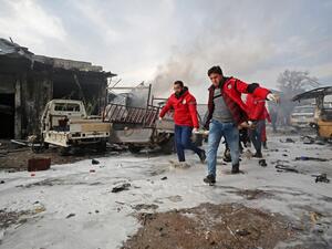 Syrian paramedics carry away on a stretcher a wounded man following a regime air strike on a vegetable market in Syria's last major opposition bastion of Idlib on January 15, 2020. (AFP/ File Photo)
