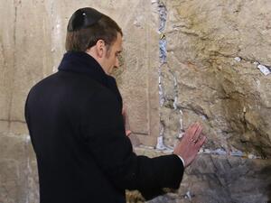 French President Emmanuel Macron prays at the Western Wall, Judaism's holiest prayer site, in Jerusalem's Old City on January 22, 2020. (AFP/ File Photo)