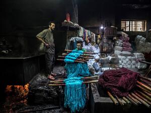 Salama and his relatives lay out the long, flowing threads, which will be used for everything from handmade shoes to rugs and drapes, and dip them in huge, piping-hot colour baths -- no gloves or masks protecting them from the dyes and chemical fumes. The workshop in Islamic Cairo has been going strong for over a hundred years. Khaled DESOUKI / AFP