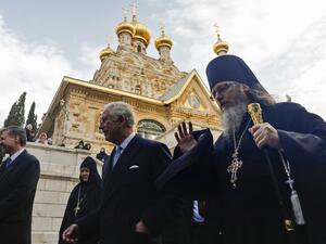 Britain's Charles (R), Prince of Wales, walks with Roman Krassovsky, Archimandrite of the Russian Orthodox Church Outside Russia (ROCOR) and chief of its Russian Ecclesiastical Mission in Jerusalem, as the former visits the Russian Orthodox Church of Mary Magdalene on the Mount of Olives in Jerusalem on January 24, 2020. Ahmad GHARABLI / AFP