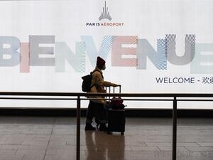 A passenger coming from China, leaves the Terminal wearing a protective face mask after landing in Charles De Gaule Airport on January 26, 2020 in Roissy-en-France. (AFP/ File Photo)