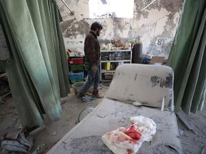A Syrian man inspects damages in Al-Iman hospital following a reported Russian air strike in the town of Sarjah, northwest of Maaret al-Numan in the northwestern Syrian province of Idlib, on January 26, 2020.(AFP/ File Photo)