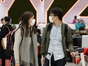 Travellers are seen wearing masks at the international arrivals area at the Toronto Pearson Airport in Toronto, Canada, January 26, 2020. Toronto Public Health confirmed Saturday that a case of the novel coronavirus that originated in Wuhan, China is currently being treated in a Toronto Hospital. Cole BURSTON / AFP