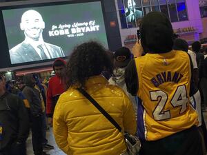 People gather by the Staples Center in Los Angeles on January 26, 2020 as they pay tribute to former NBA and Los Angeles Lakers player Kobe Bryant following his death in a helicopter crash near Los Angeles. (AFP/ File Photo)