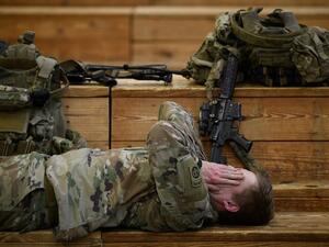 U.S. troops from the Army's 82nd Airborne Division get some rest at Green Ramp before they head out for a deployment to the Middle East on January 4, 2020 in Fort Bragg, North Carolina. (AFP/ File Photo)