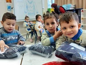 Students receive sweaters in Sidon, Dec. 21, 2019. (The Daily Star/Mohammed Zaatari)
