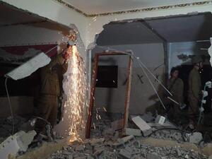 Demolishing two Palestinian homes (Twitter)